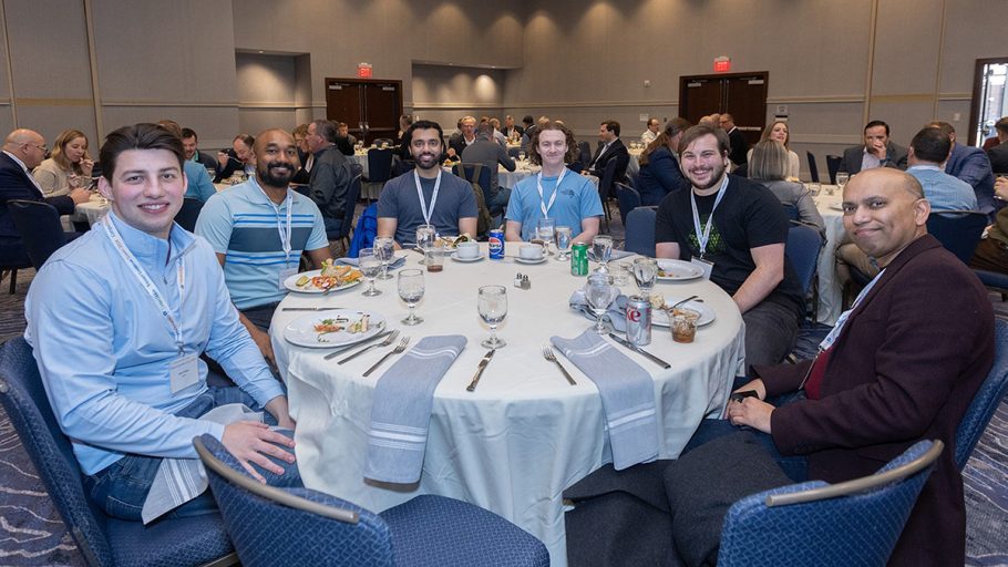 Attendees enjoying the food and drinks during lunch