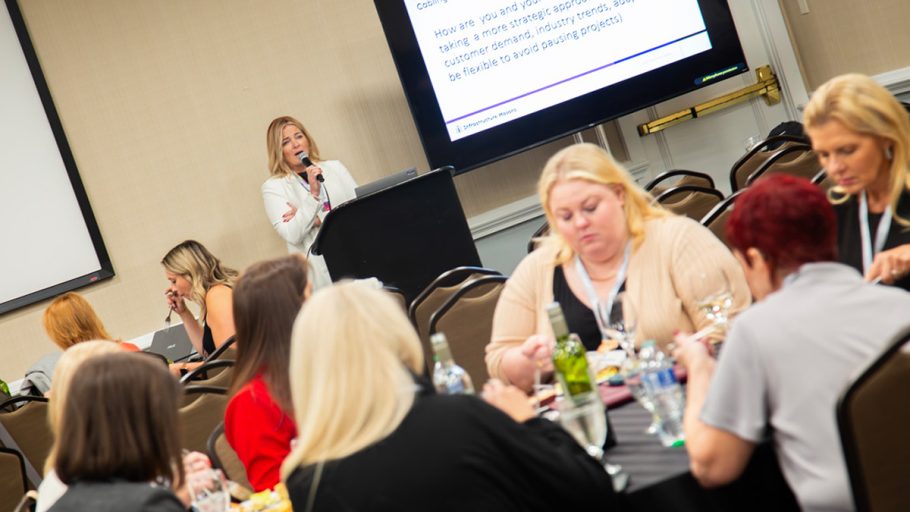 Mara Ervin, East Coast Regional Chair for iM Women, leads the discussion during the iM Women Welcome Lunch