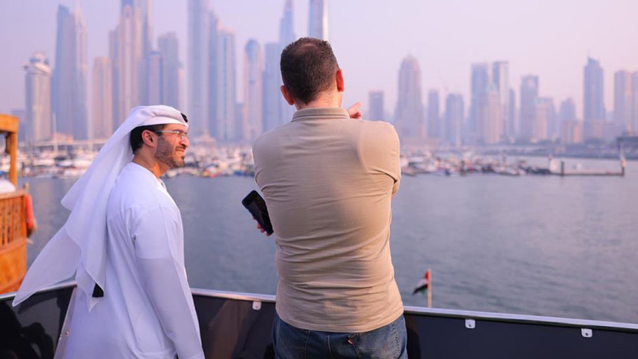 Pictured in conversation against the landscape of the Dubai Marina